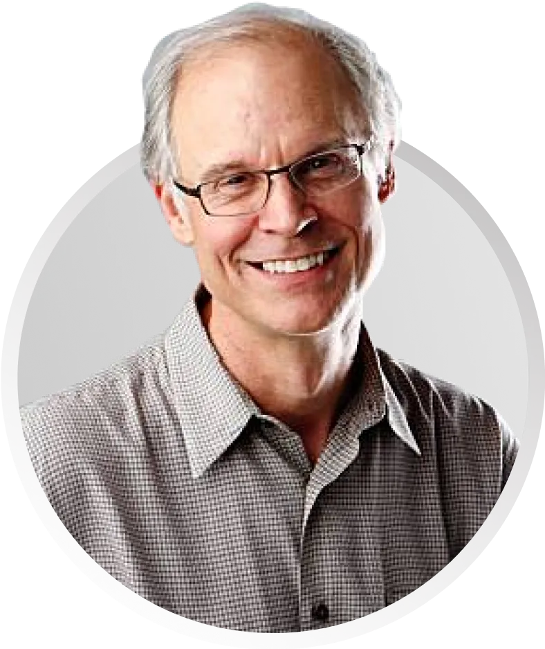 Headshot of cartoonist Tom Meyer smiling into camera.
